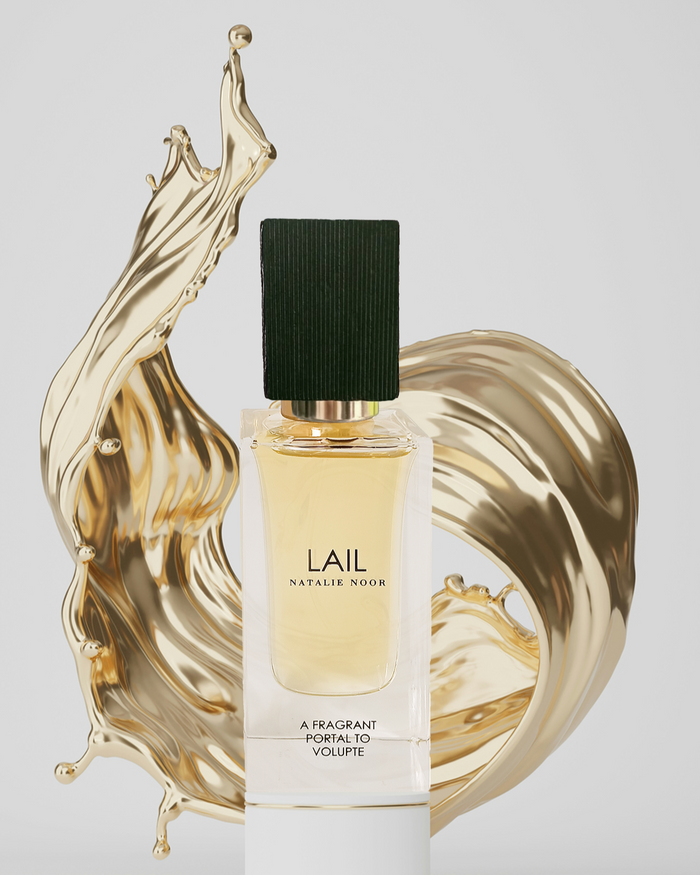 Perfume bottle labeled 'Lail' on a decorative gold stand with a white background.