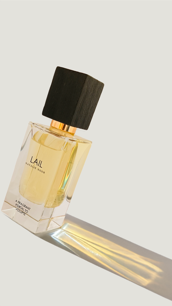 Perfume bottle labeled 'LAIL' on a light background