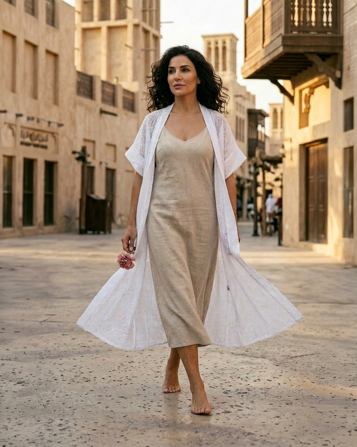 Natalie Noor wearing the Sillage Robe in pure white doddy cotton. Sahara, a luxury resort wear collection by Natalie Noor.
