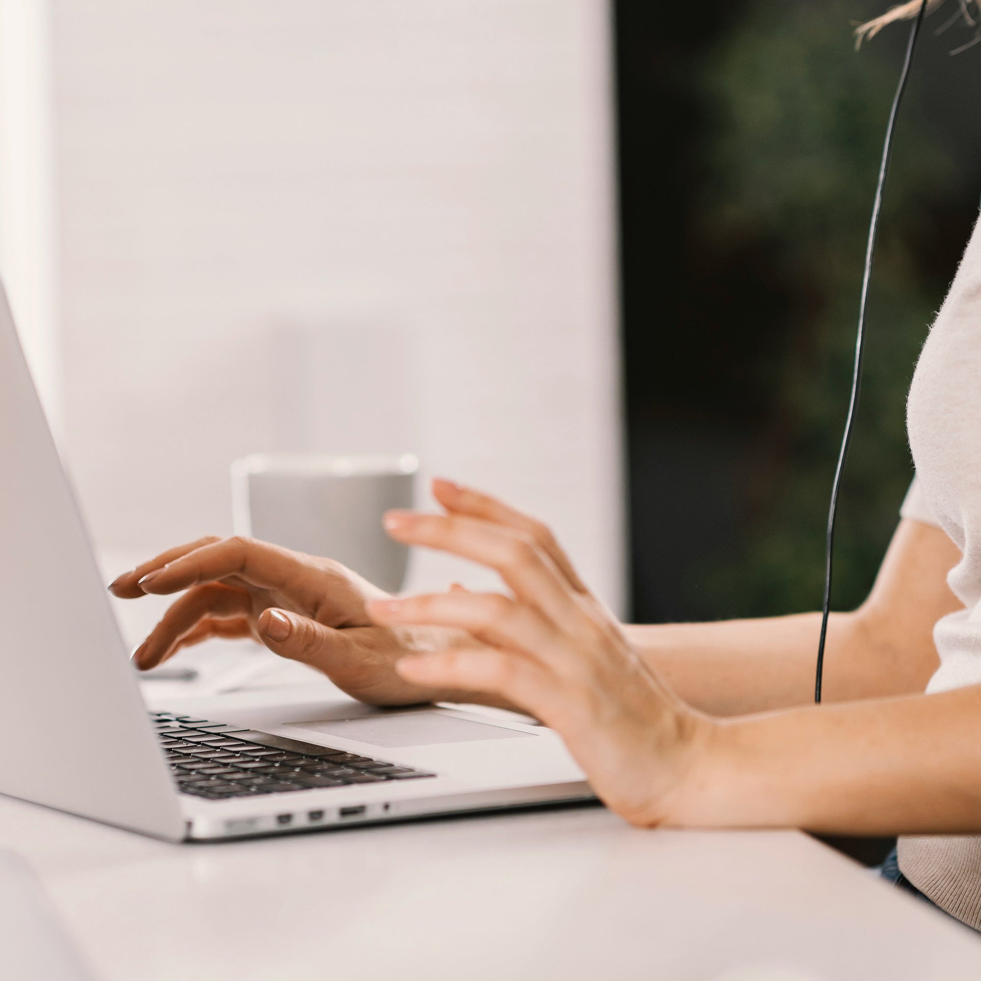 Person using a laptop with a blurred background