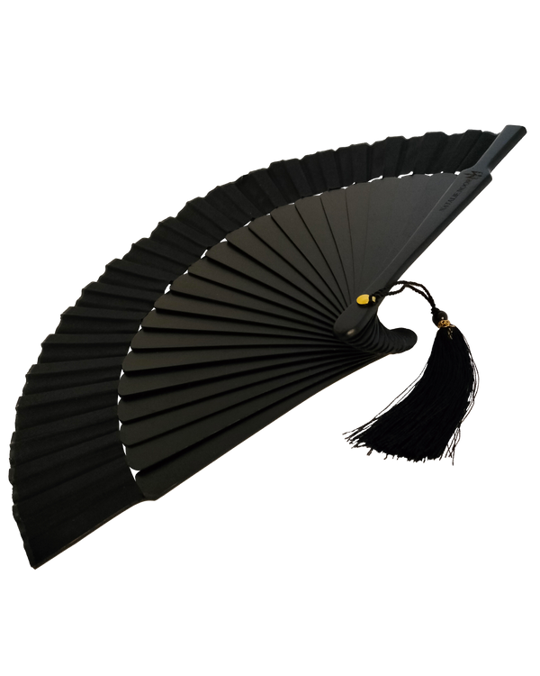 Black hand fan with tassels on a white background