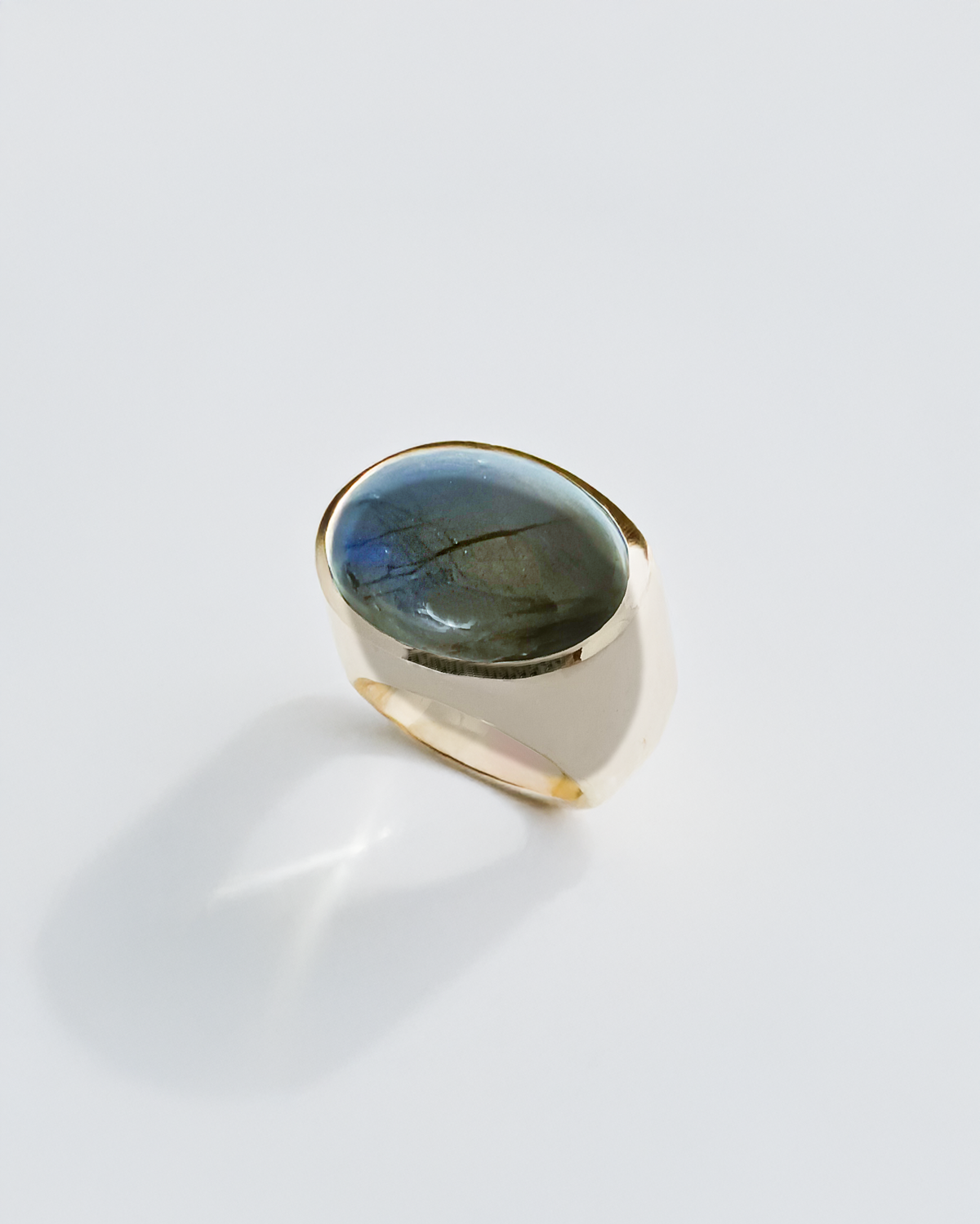 Silverring with a blue labradorite gemstone on a white background. Maison Natalie Noor, jewelry lit by desire.