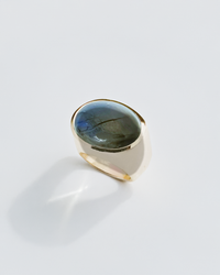 Silverring with a blue labradorite gemstone on a white background. Maison Natalie Noor, jewelry lit by desire.