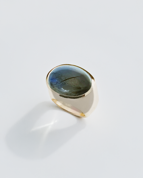 Silverring with a blue labradorite gemstone on a white background. Maison Natalie Noor, jewelry lit by desire.