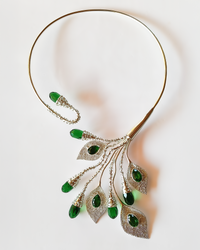 Elegant and statement silver torc necklace with green obsidian gemstones on a white background. Maison Natalie Noor, jewelry lit by desire.