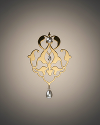 Fine and stylish Gold and silver pearl earrings on a beige background. Maison Natalie Noor, Sharafeh Collection - Jewelry lit by Desire