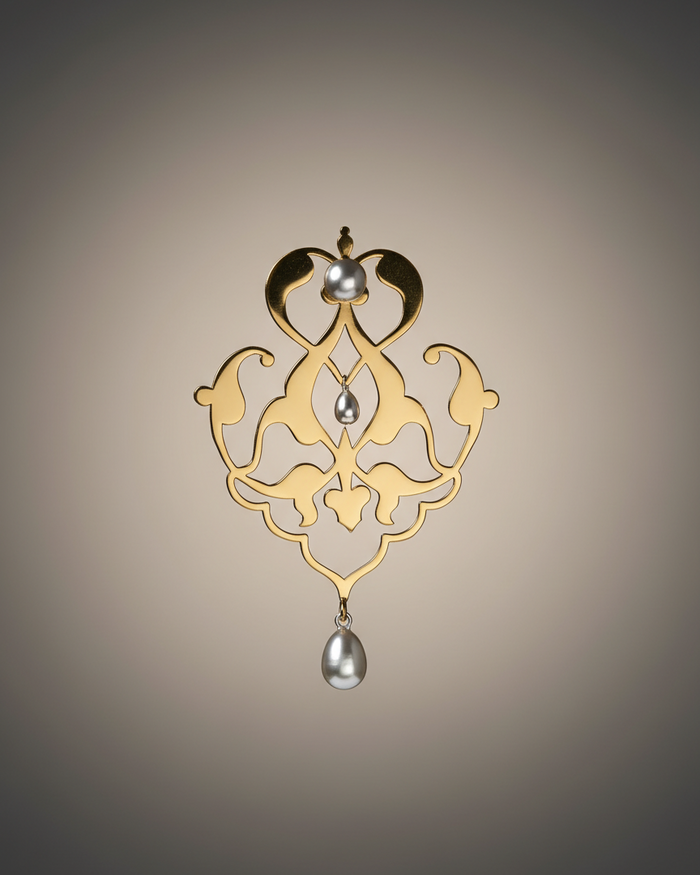 Fine and stylish Gold and silver pearl earrings on a beige background. Maison Natalie Noor, Sharafeh Collection - Jewelry lit by Desire